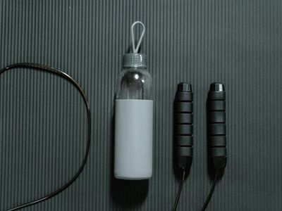 Minimalist fitness mat and a bottle of water.